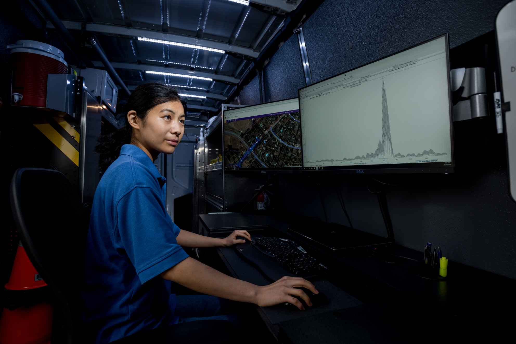 an employee looking at leak detection software on screen