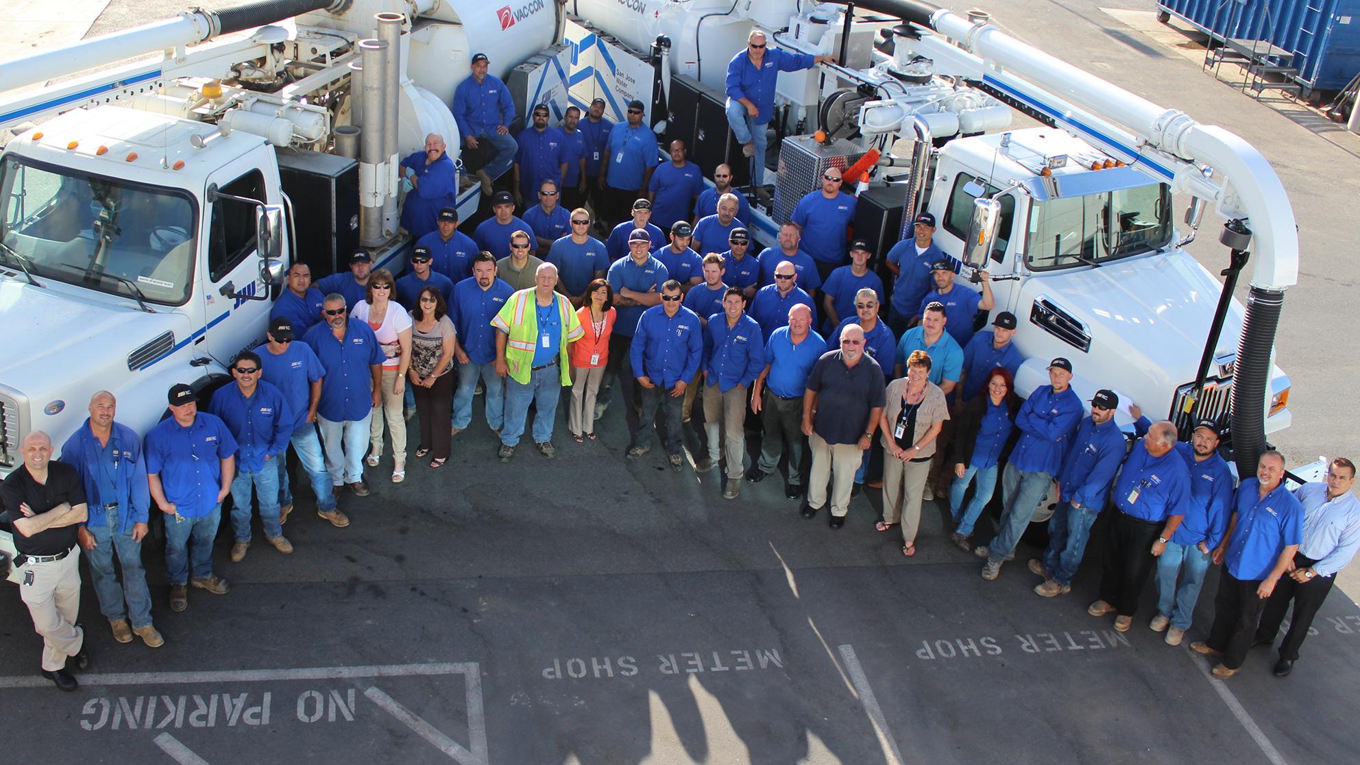 an overhead shot of San Jose Water employees standing by trucks 