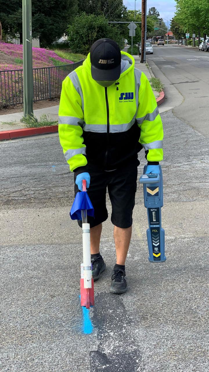 San Jose Water employee marking the street