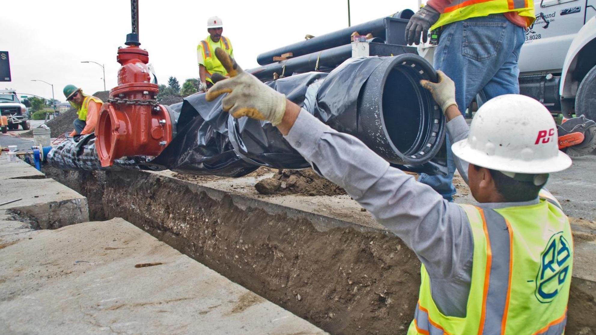 San Jose Water crew working on a pipe in a trench