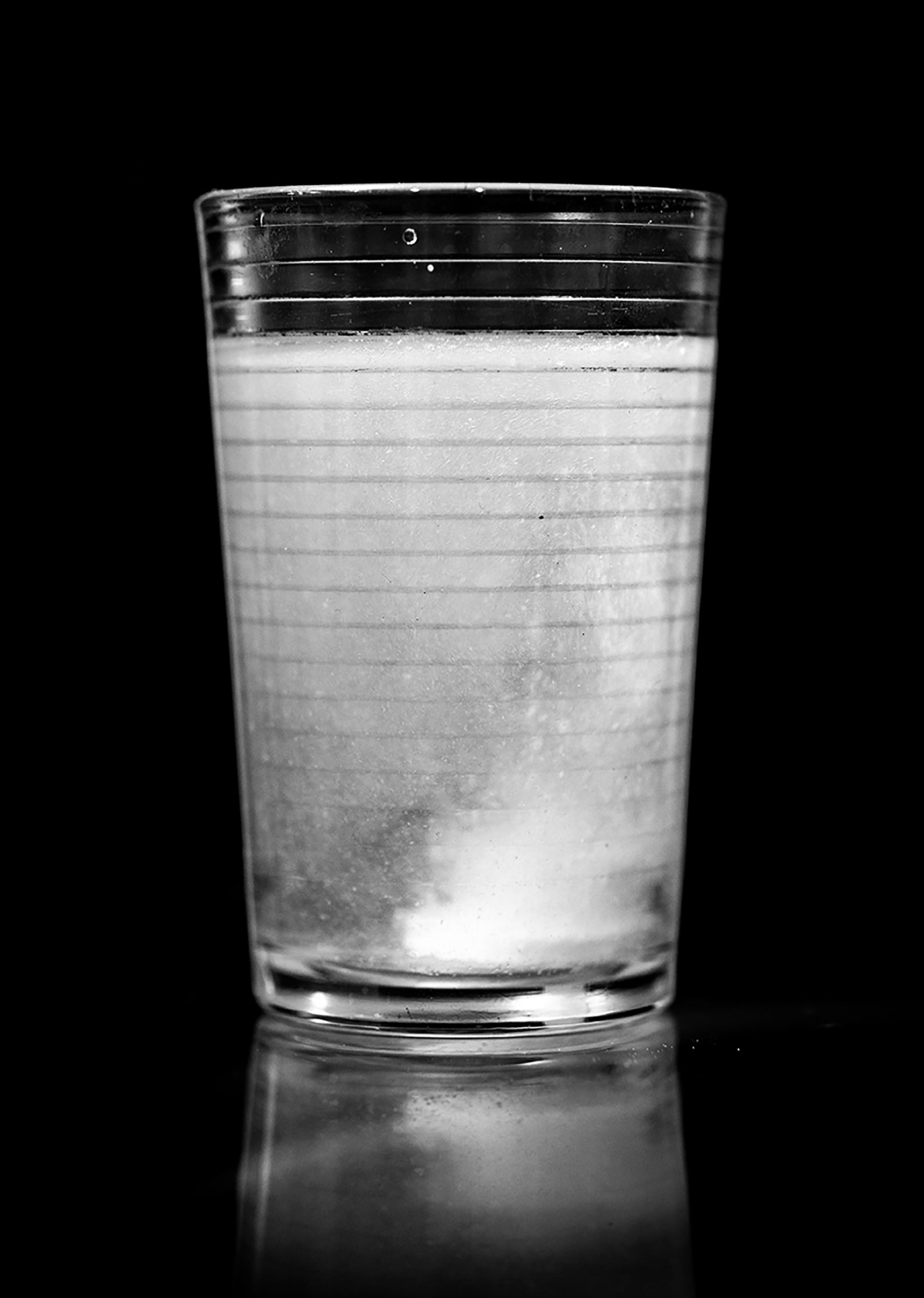 a glass of cloudy water