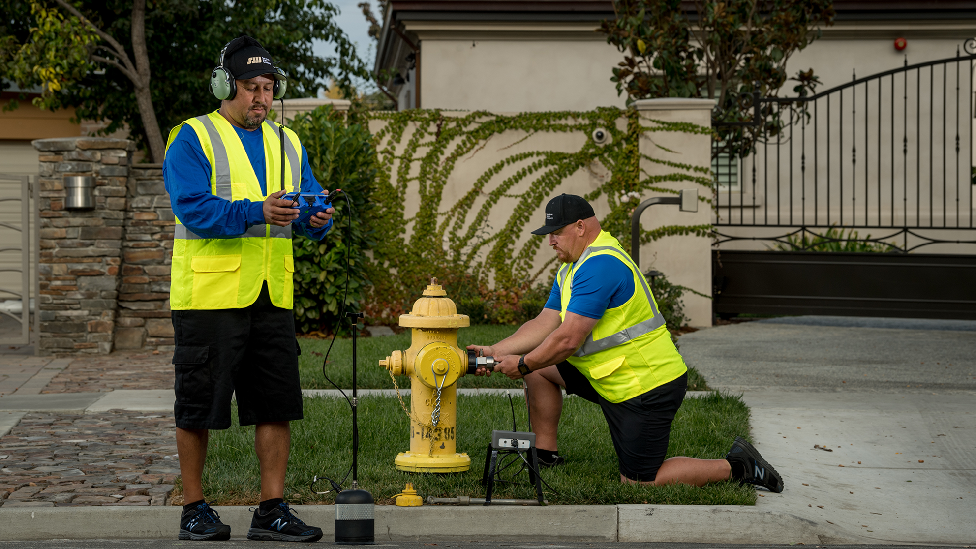 San Jose Water employees using leak detection devices on a a fire hydrant