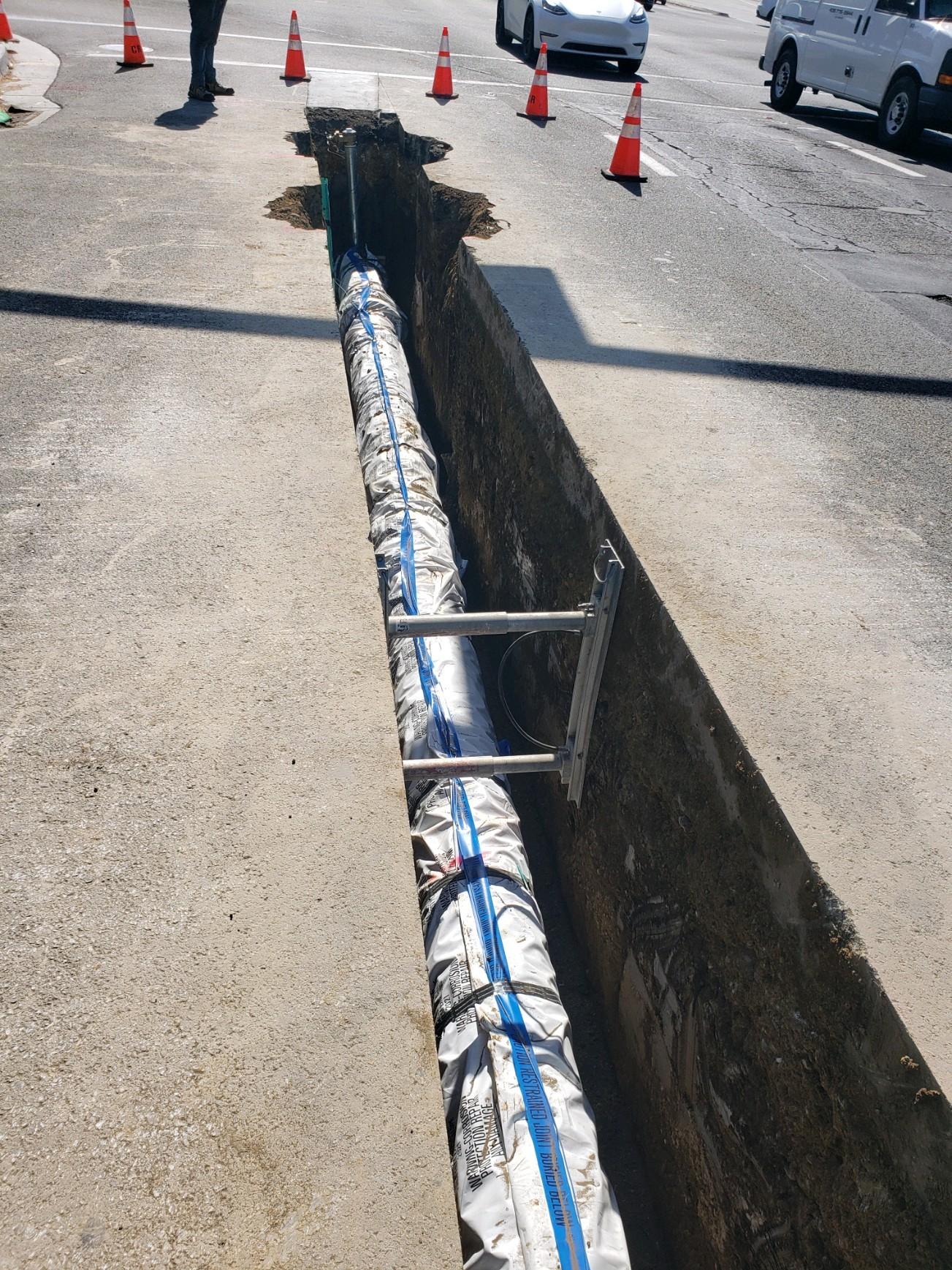 a trench dug out on Stevens Creek Blvd. 