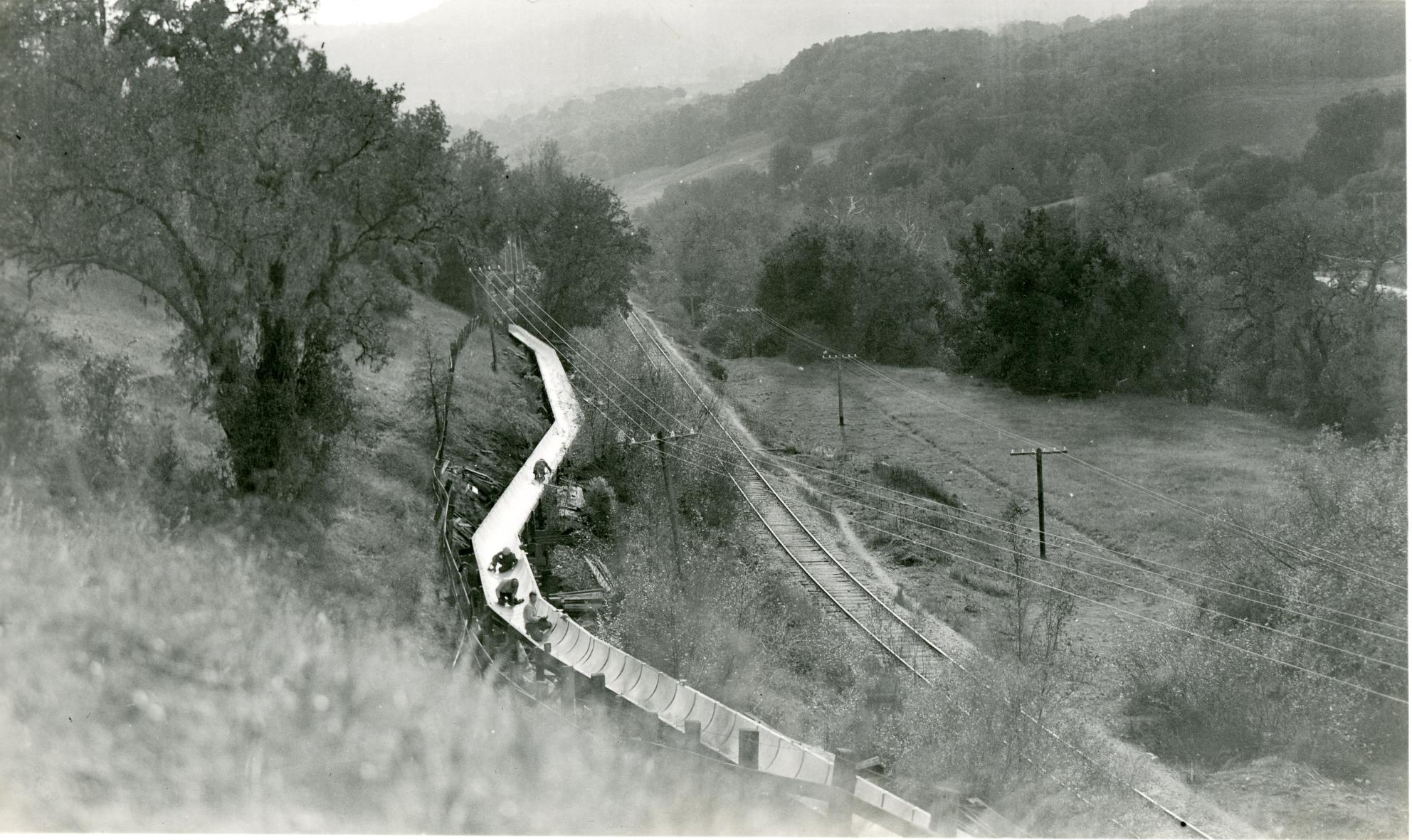 an old photo of construction inside a flume