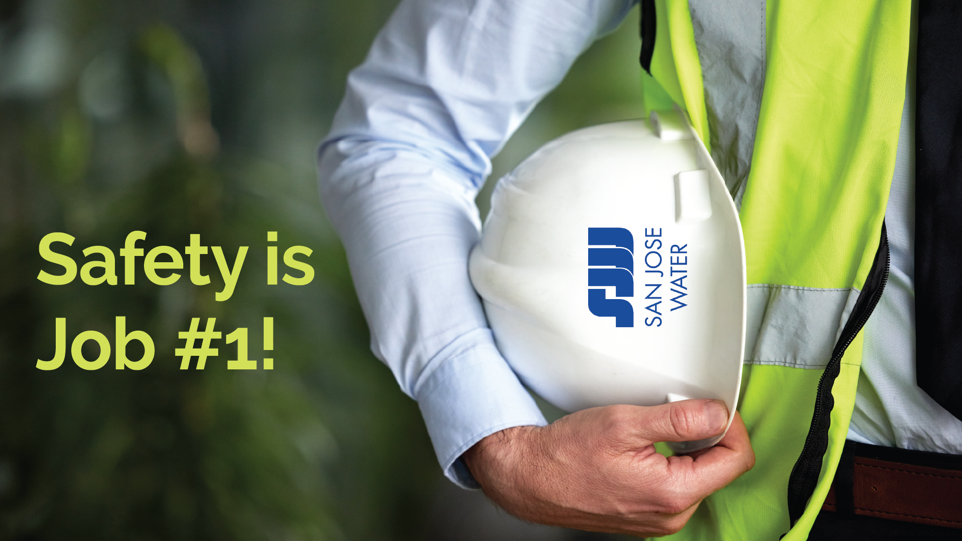 person holding a San Jose Water hard hat with text Safety is Job #1!