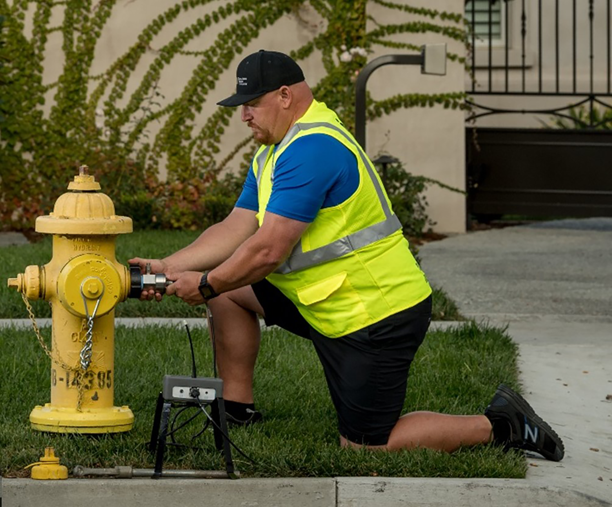 San Jose Water employee checking for leaks on a hydrant