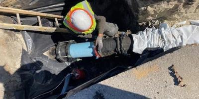 San Jose Water employee working on a pipe